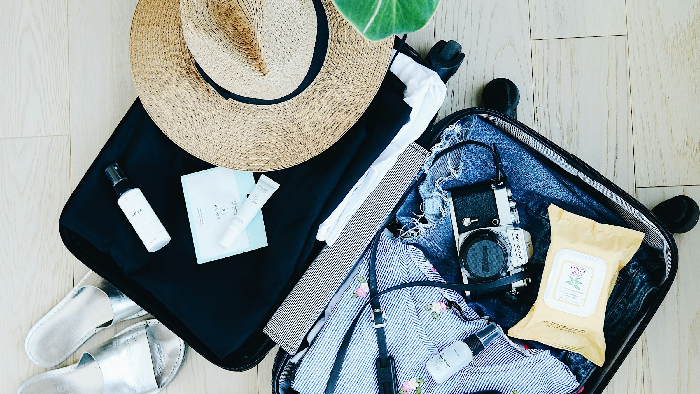 Packing essentials for a Dillon Beach getaway — sun hat, sandals, and camera