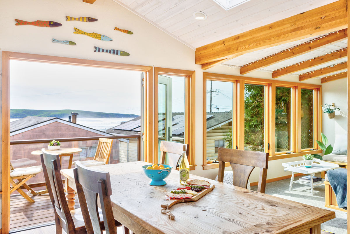 Sea Esta modern living room with ocean-view windows in Dillon Beach
